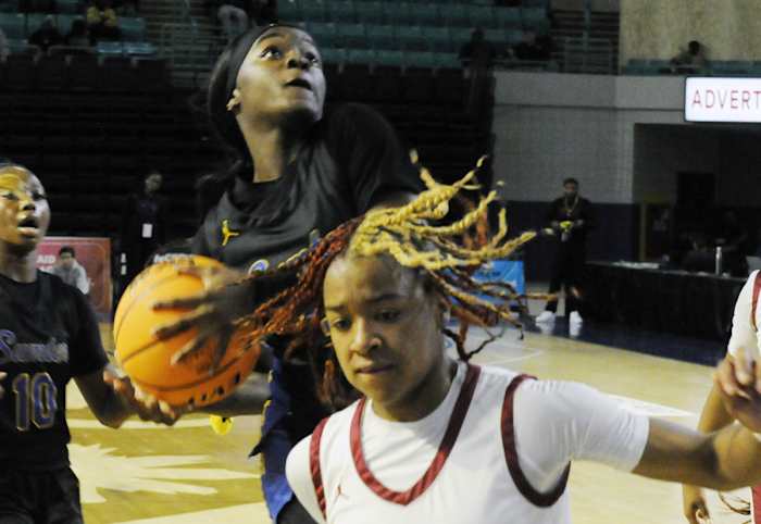 Sumter guard Kiara Croskey drives in behind Rock Hill's Omadeah Ford (20) for two points in the 2024 SCHSL Class 5-A Girls Basketball State Championship Game. (3/1/2024)